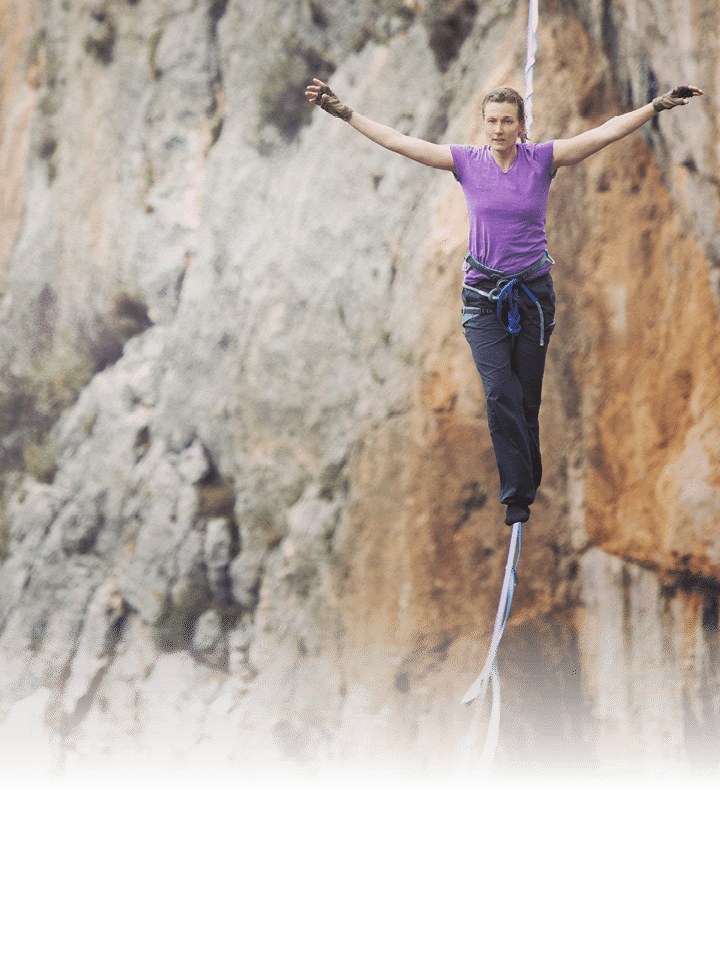 Woman balancing on the rope concept of risk taking and challenge 