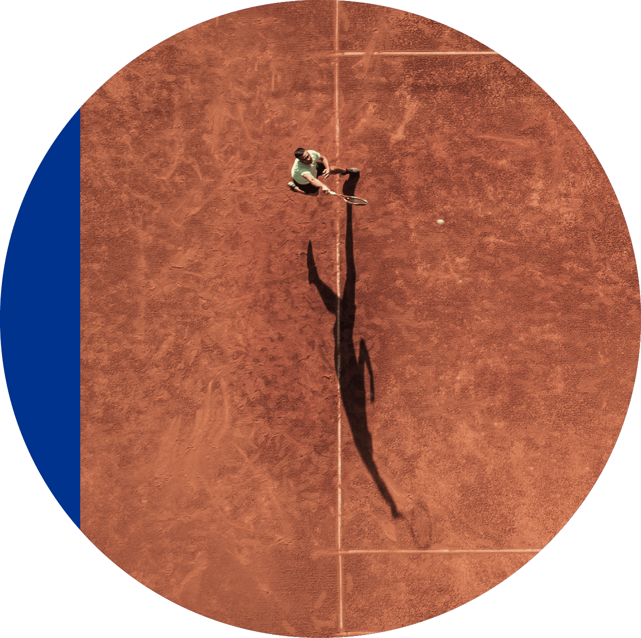 One part of tennis clay court with one man player only  He is mature adult, and very agile and healthy  Photo made with drone, directly above 