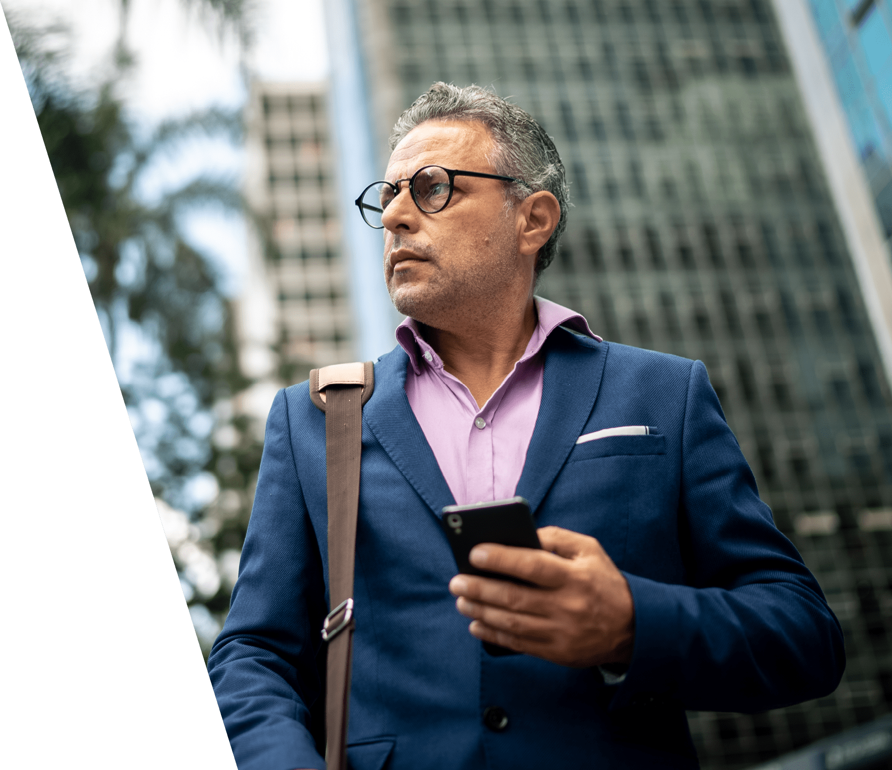 Contemplative man looking away in the street