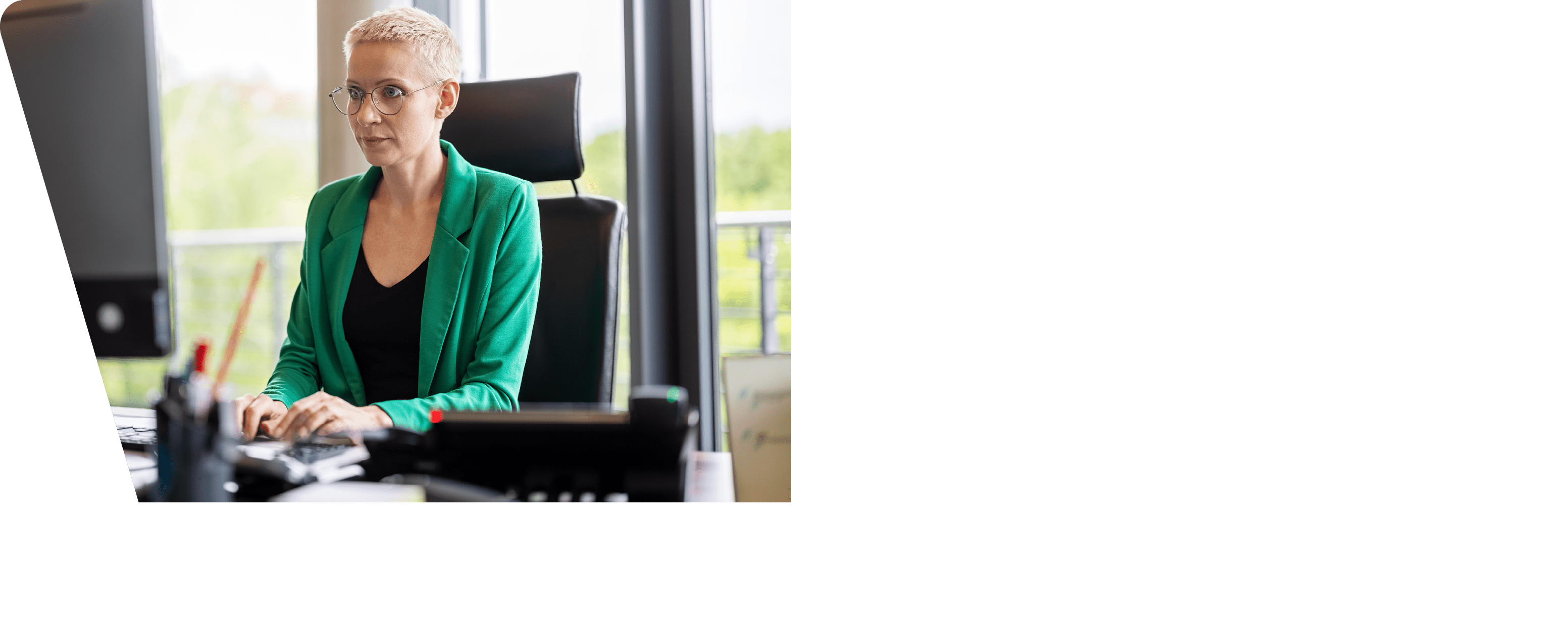Businesswoman working at her desk  Female professional working on the desktop computer in office 